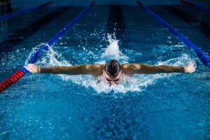 Butterfly stroke swimmer front view
